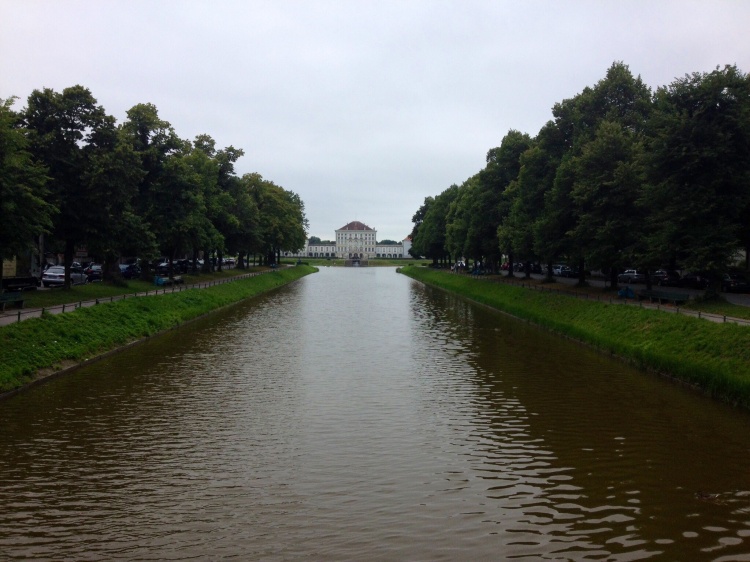 The view of Schloss Nymphenburg from the end of the canal within the palace's English Garden.